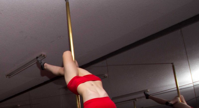 Michaela performing in pole dancing routine at one of Studio Verve's Student Showcase Nights
